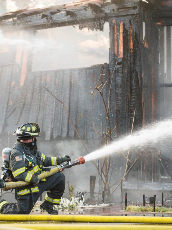 firefighter-sprays-water-on-burning-house-fire-2023-11-27-04-56-39-utc